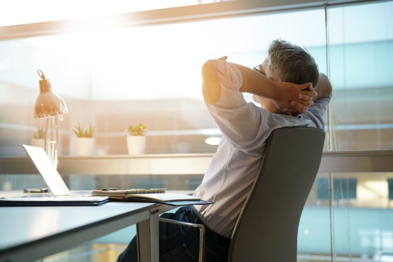 Businessman,In,Office,Relaxing,In,Chair